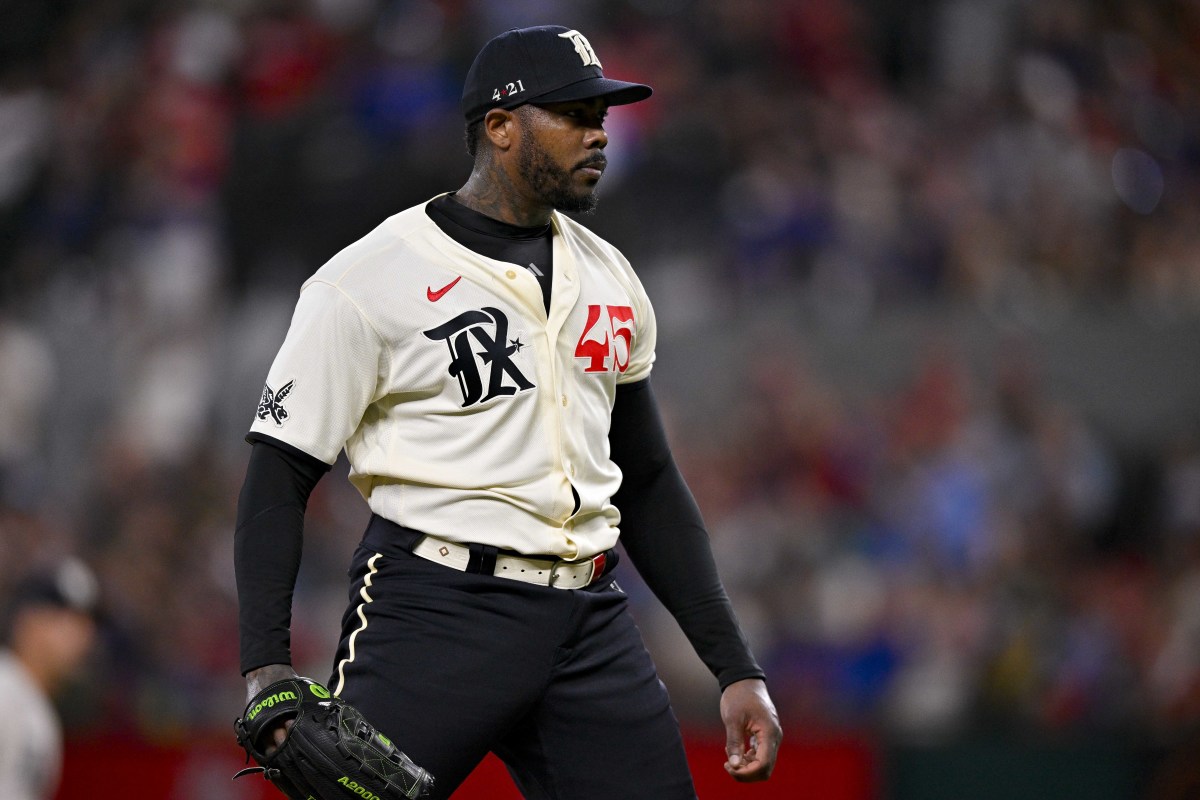 Jul 14, 2023; Arlington, Texas, USA; Texas Rangers relief pitcher Aroldis Chapman (45) reacts to striking out Cleveland Guardians center fielder Myles Straw (not pictured) to end the eighth inning at Globe Life Field. Mandatory Credit: Jerome Miron-USA TODAY Sports